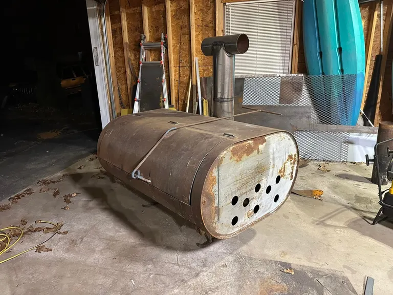Custom smoker fabrication built from reclaimed tank